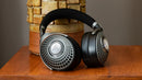 Focal Bathys MG Wireless Noise-Cancelling Hi-Fi Headphones leaning up against a pillar
