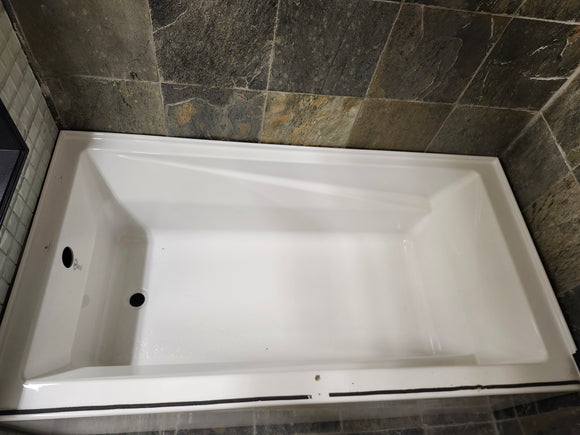 Neptune 60 x 32 built in bathtub as is floormodel with skirt afr azea k8