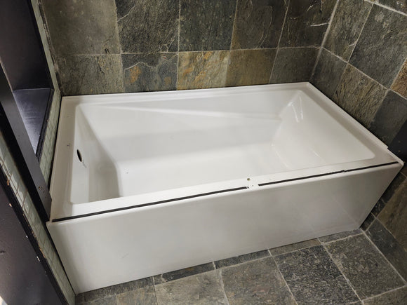 Neptune 60 x 32 built in bathtub as is floormodel with skirt afr azea k8